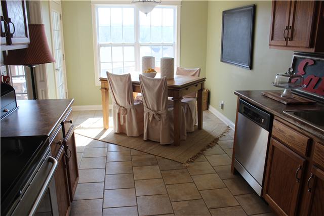 2167 Powell Road Clarksville, TN 37043 - Photo 9 of 20 Eat in area is a wonderful space with lots of natural light. Notice the beautiful tiled flooring.
