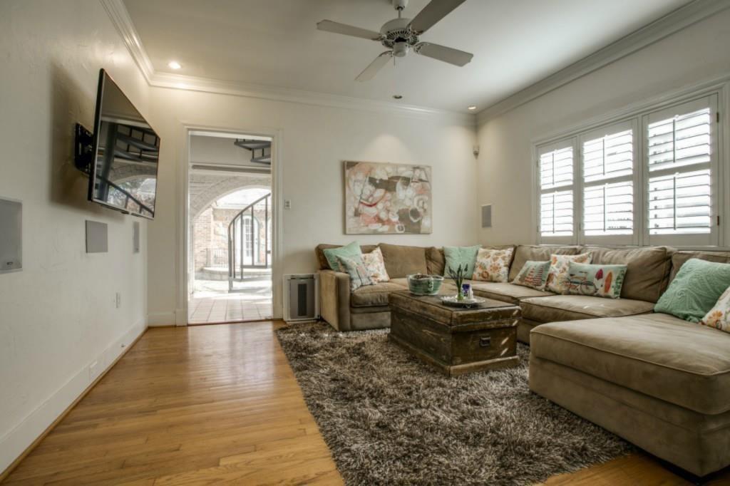5419 Merrimac Avenue Dallas, TX 75206 - Photo 13 of 17 Living area featuring warm wood-finish flooring and a ceiling fan