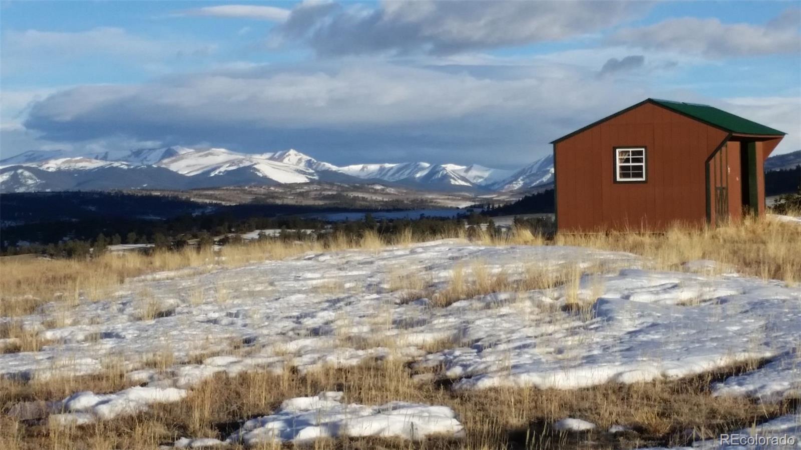 1289 Willow Way Jefferson, CO 80456 - Photo 4 of 49 a view of a house with a yard and a large tree