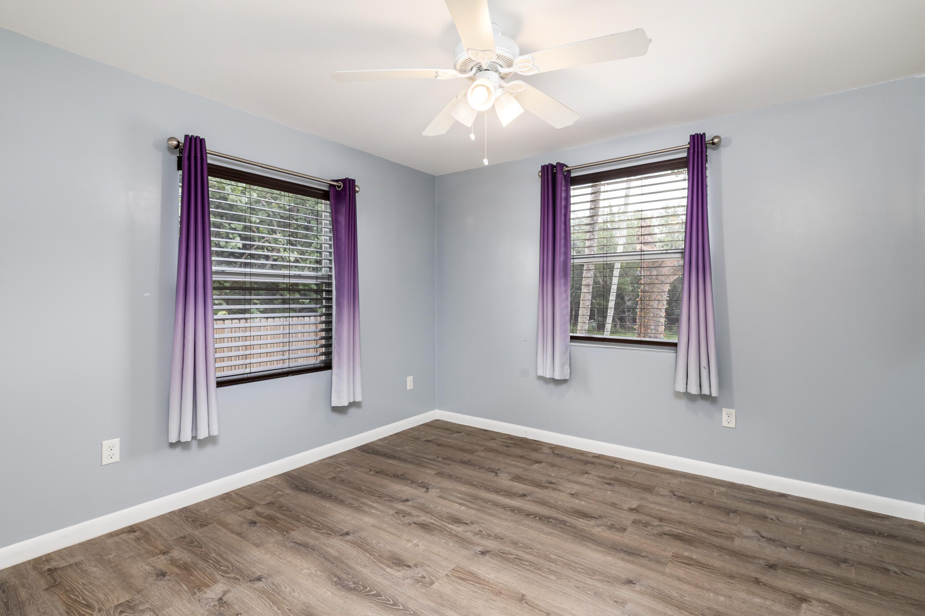 30023 Pine Channel Road Big Pine Key, FL 33043 - Photo 11 of 31 a view of an empty room with a window and wooden floor
