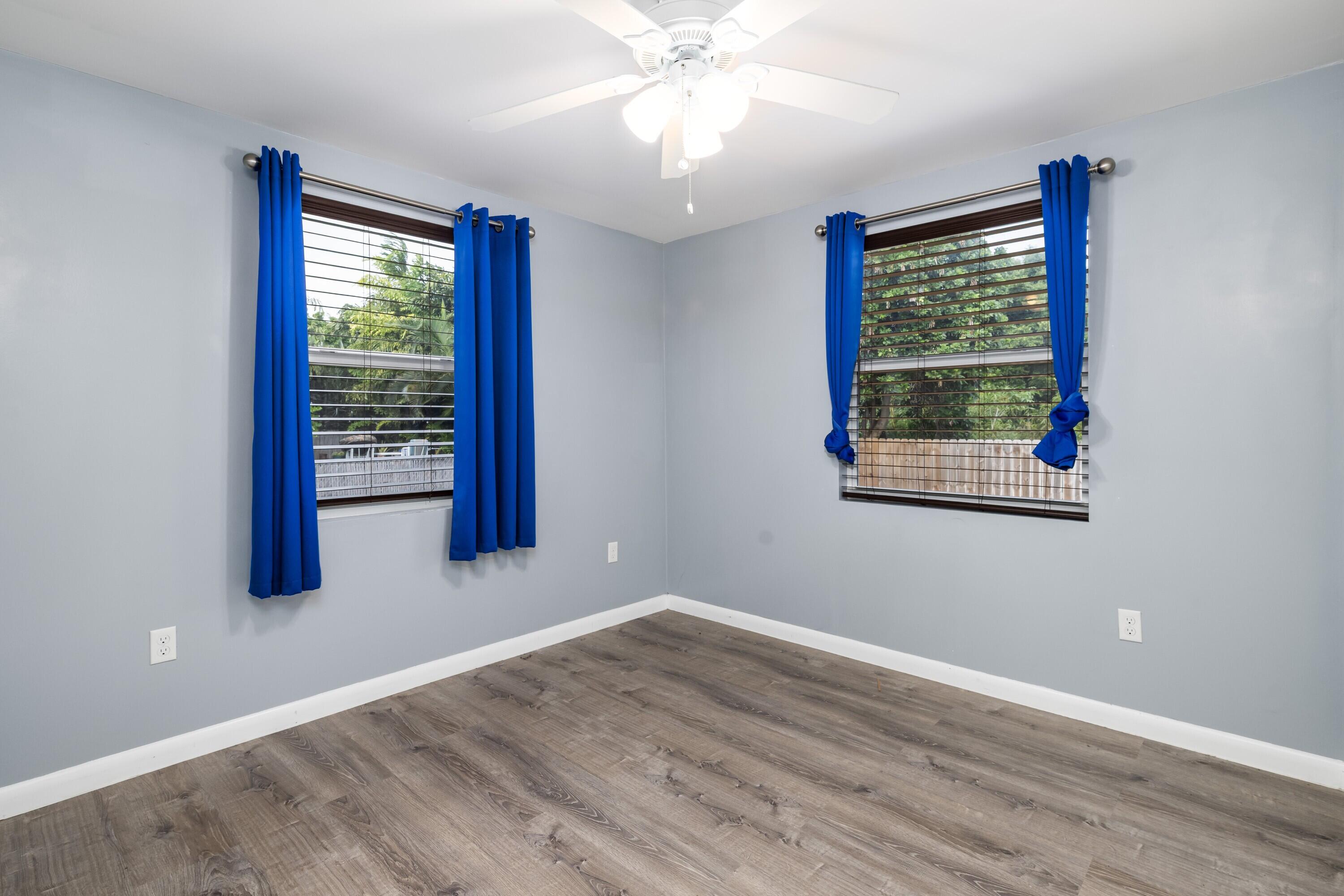 30023 Pine Channel Road Big Pine Key, FL 33043 - Photo 13 of 31 wooden floor in an empty room with a window