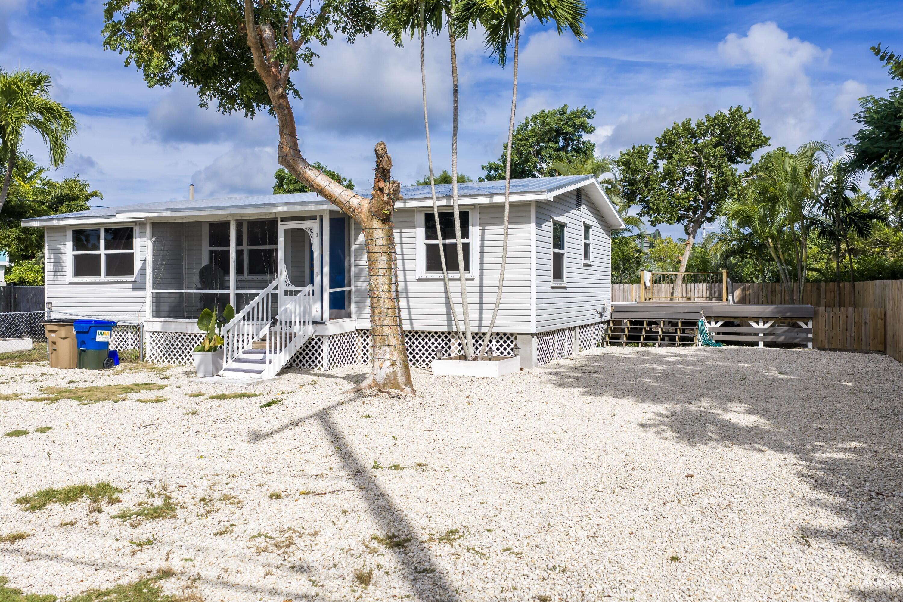 30023 Pine Channel Road Big Pine Key, FL 33043 - Photo 20 of 31 a view of a house with a patio