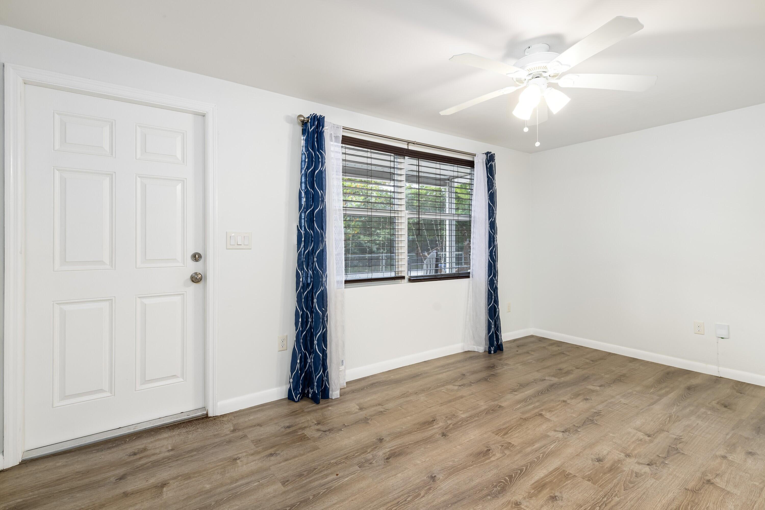 30023 Pine Channel Road Big Pine Key, FL 33043 - Photo 2 of 31 an empty room with wooden floor and windows
