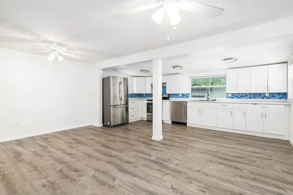 a view of kitchen with wooden floor