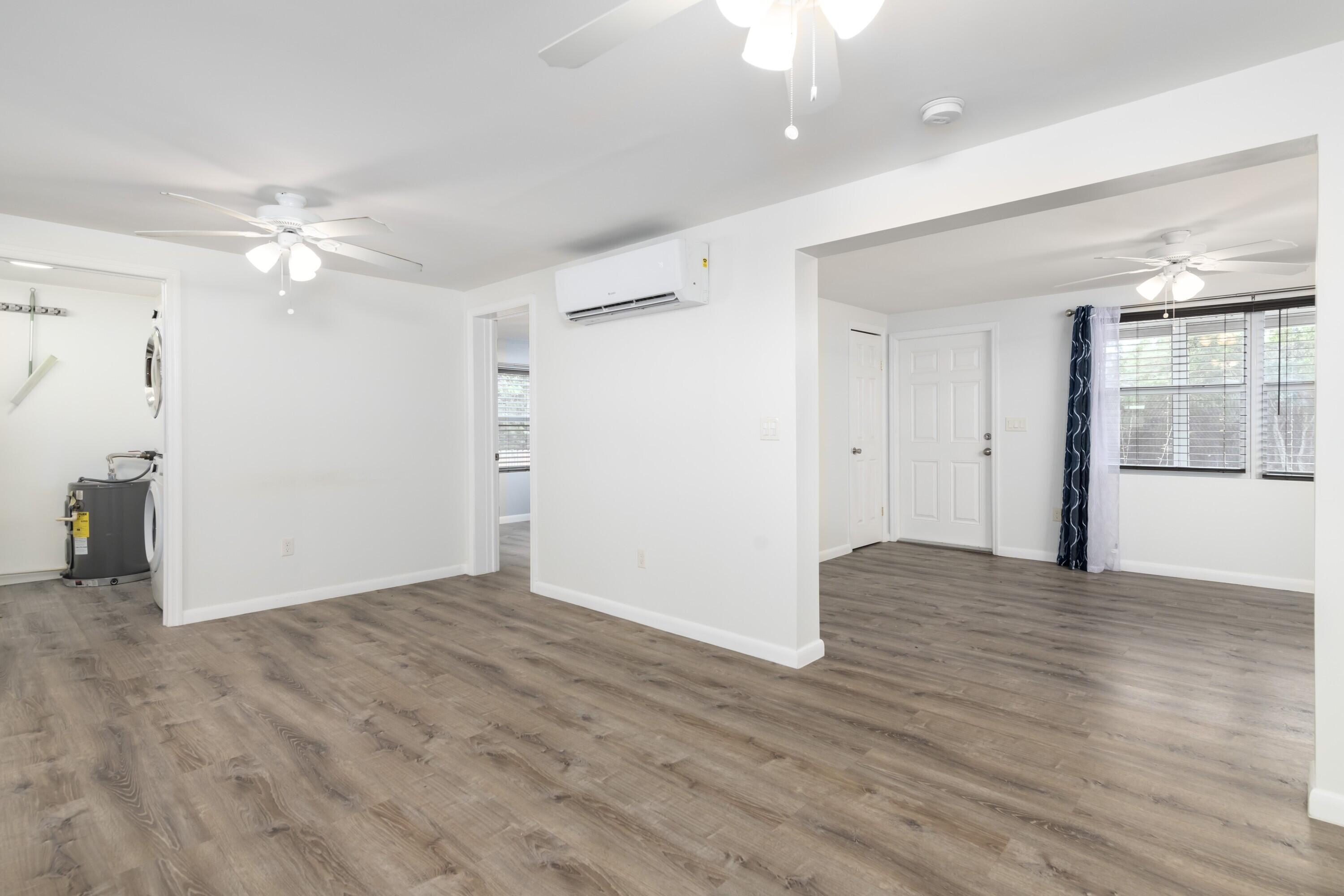 30023 Pine Channel Road Big Pine Key, FL 33043 - Photo 6 of 31 wooden floor in an empty room with a window