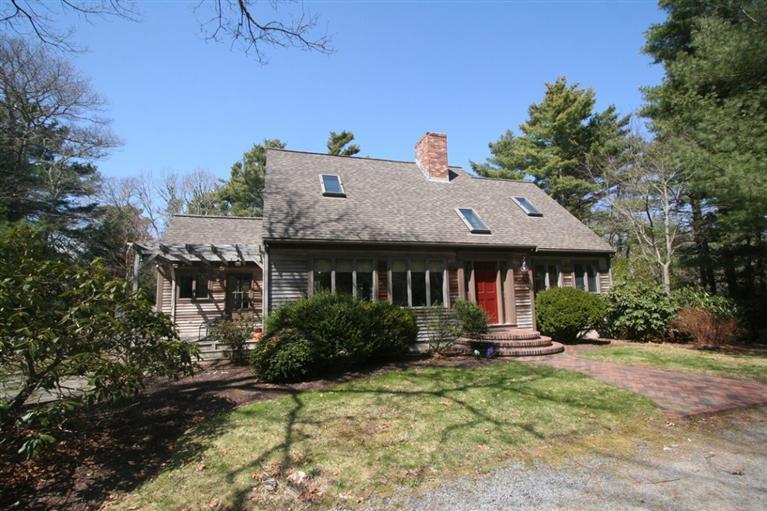 272 Pine Ridge Road Cotuit, MA 02635 - Photo 1 of 19 a backyard of a house with yard and outdoor seating