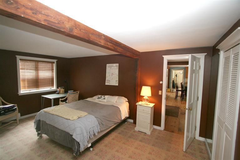 272 Pine Ridge Road Cotuit, MA 02635 - Photo 12 of 19 a bedroom with a bed and a window