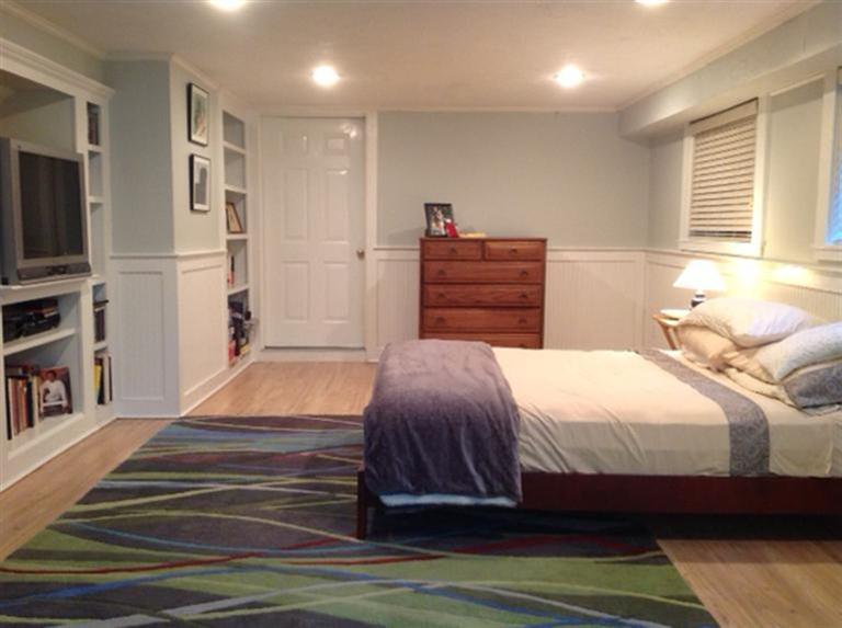 272 Pine Ridge Road Cotuit, MA 02635 - Photo 17 of 19 a bedroom with a bed and a book shelf