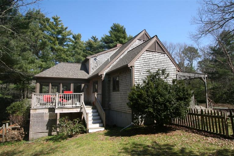 272 Pine Ridge Road Cotuit, MA 02635 - Photo 3 of 19 a front view of a house with garden
