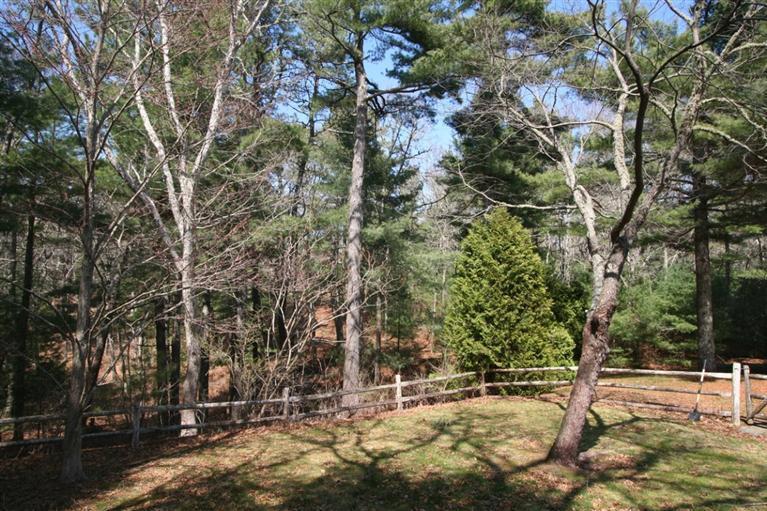 272 Pine Ridge Road Cotuit, MA 02635 - Photo 4 of 19 a backyard of a house with lots of green space
