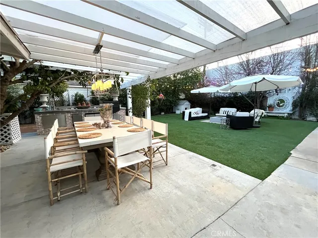 a view of yard with patio