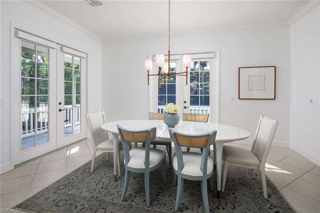 155 1st Avenue South Naples, FL 34102 - Photo 15 of 27 a view of a dining room with furniture window and outside view