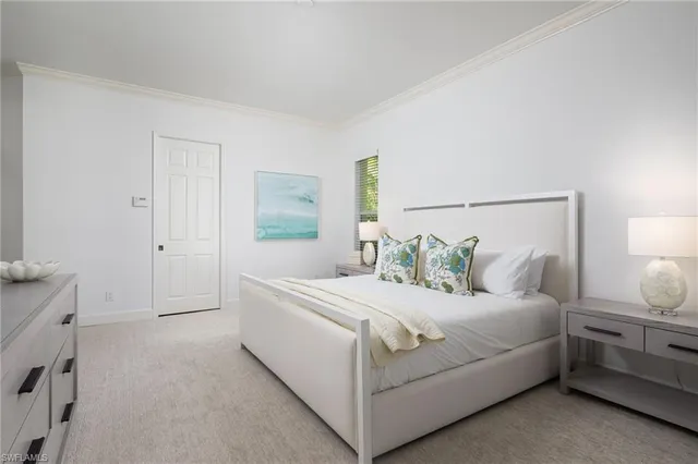 a bedroom with a bed and a night stand