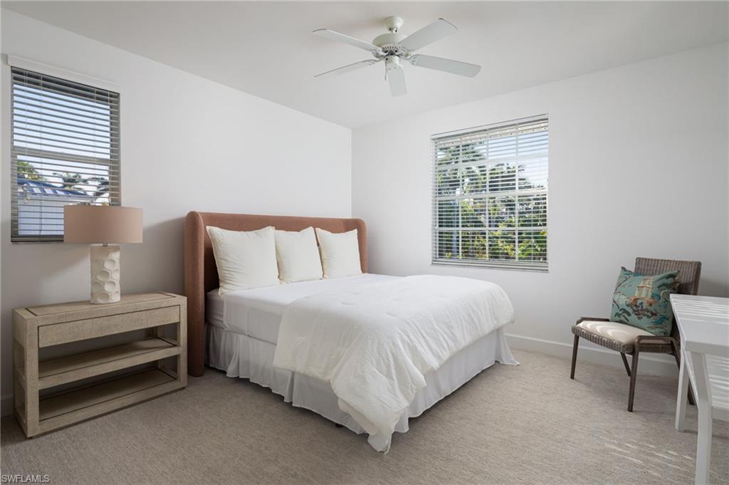 155 1st Avenue South Naples, FL 34102 - Photo 19 of 27 a bedroom with a bed and a window