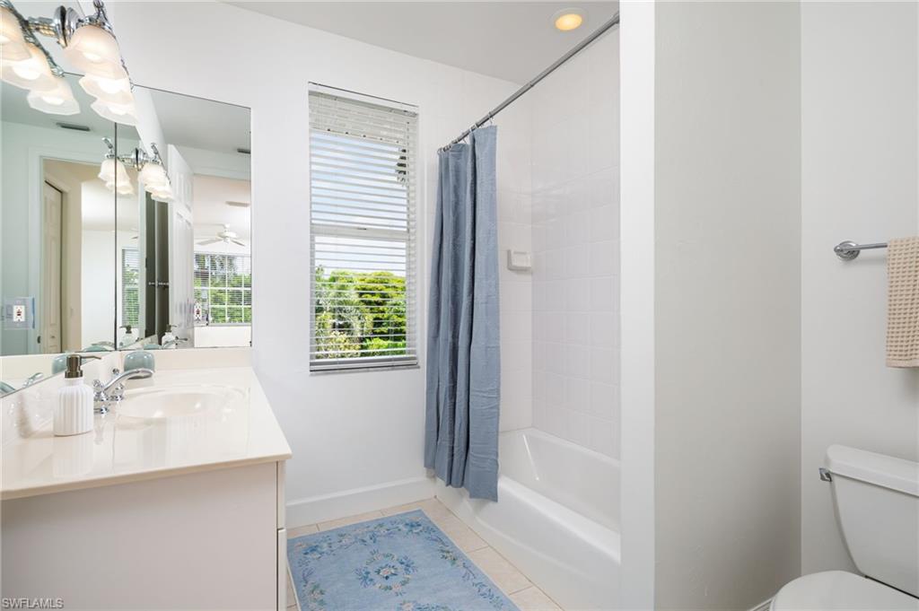 155 1st Avenue South Naples, FL 34102 - Photo 20 of 27 a bathroom with a sink a toilet and shower