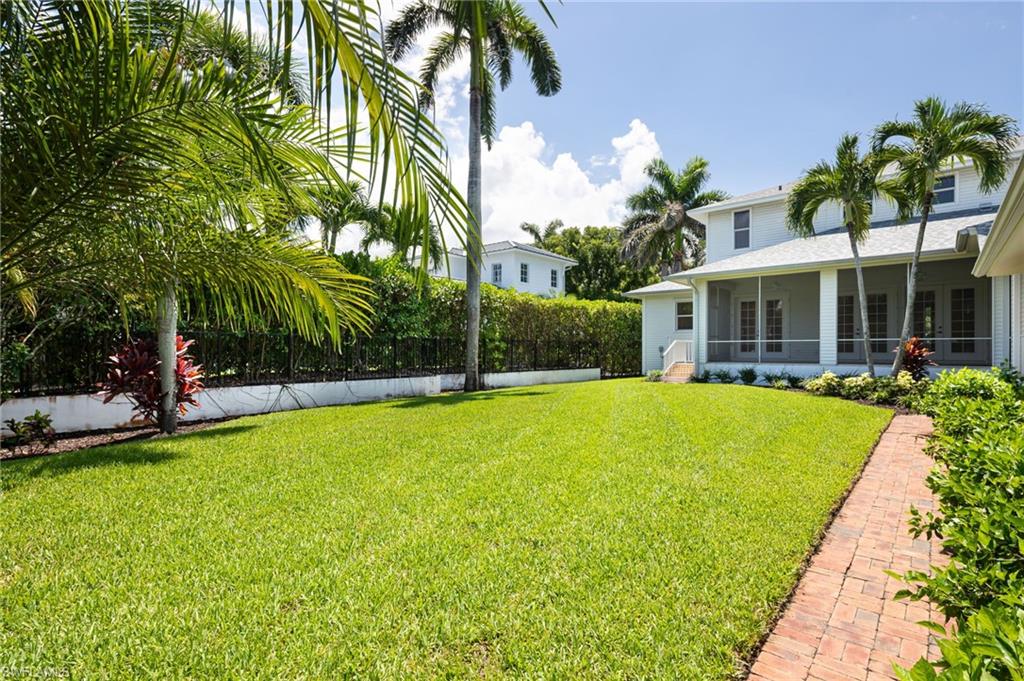 155 1st Avenue South Naples, FL 34102 - Photo 25 of 27 a view of outdoor space yard swimming pool and patio