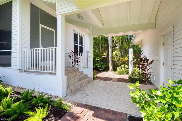 a view of a house with a flower garden