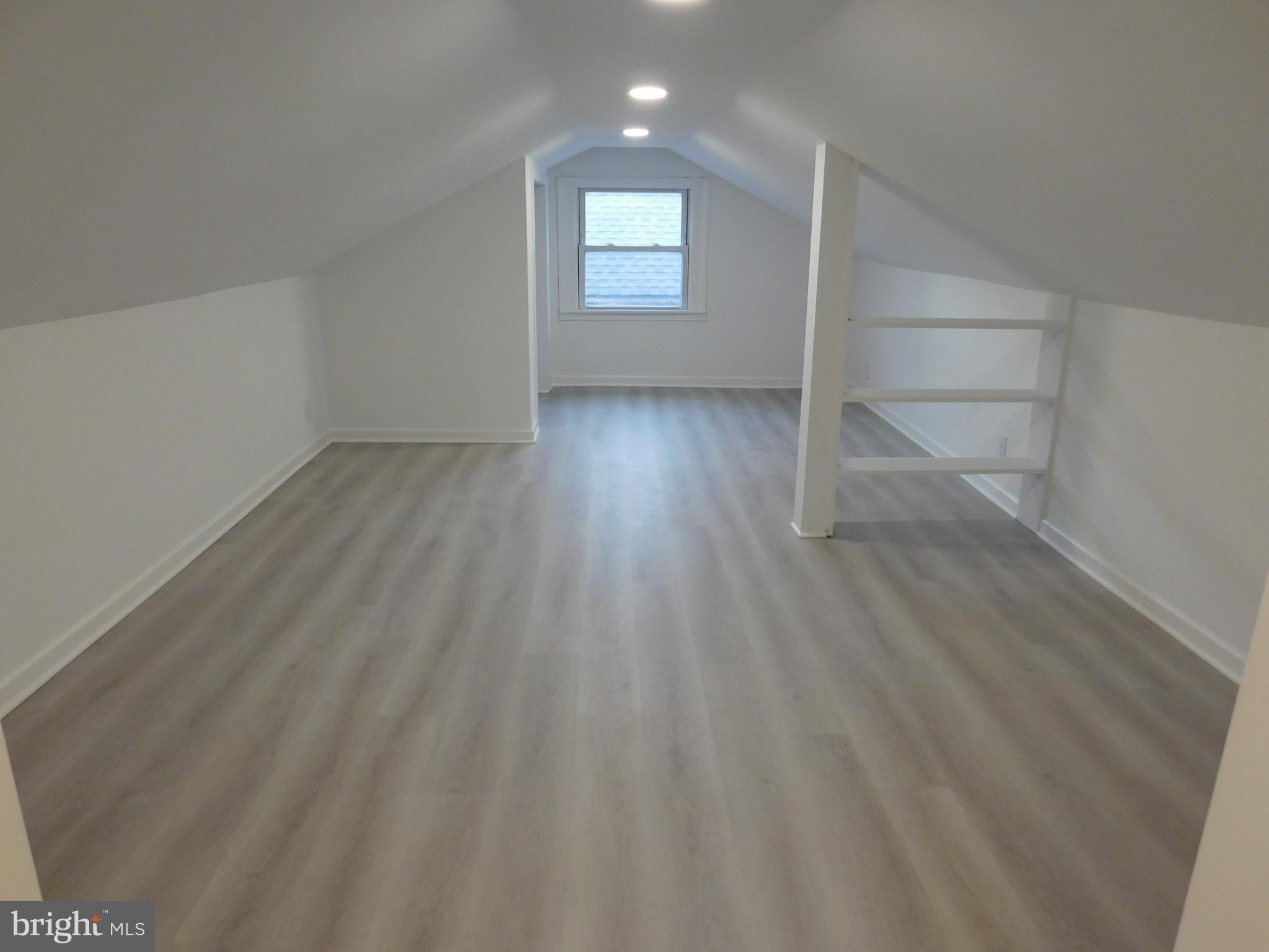 511 Cherry Street, Unit 4 Roebling, NJ 08554 - Photo 12 of 14 a view of an empty room and wooden floor