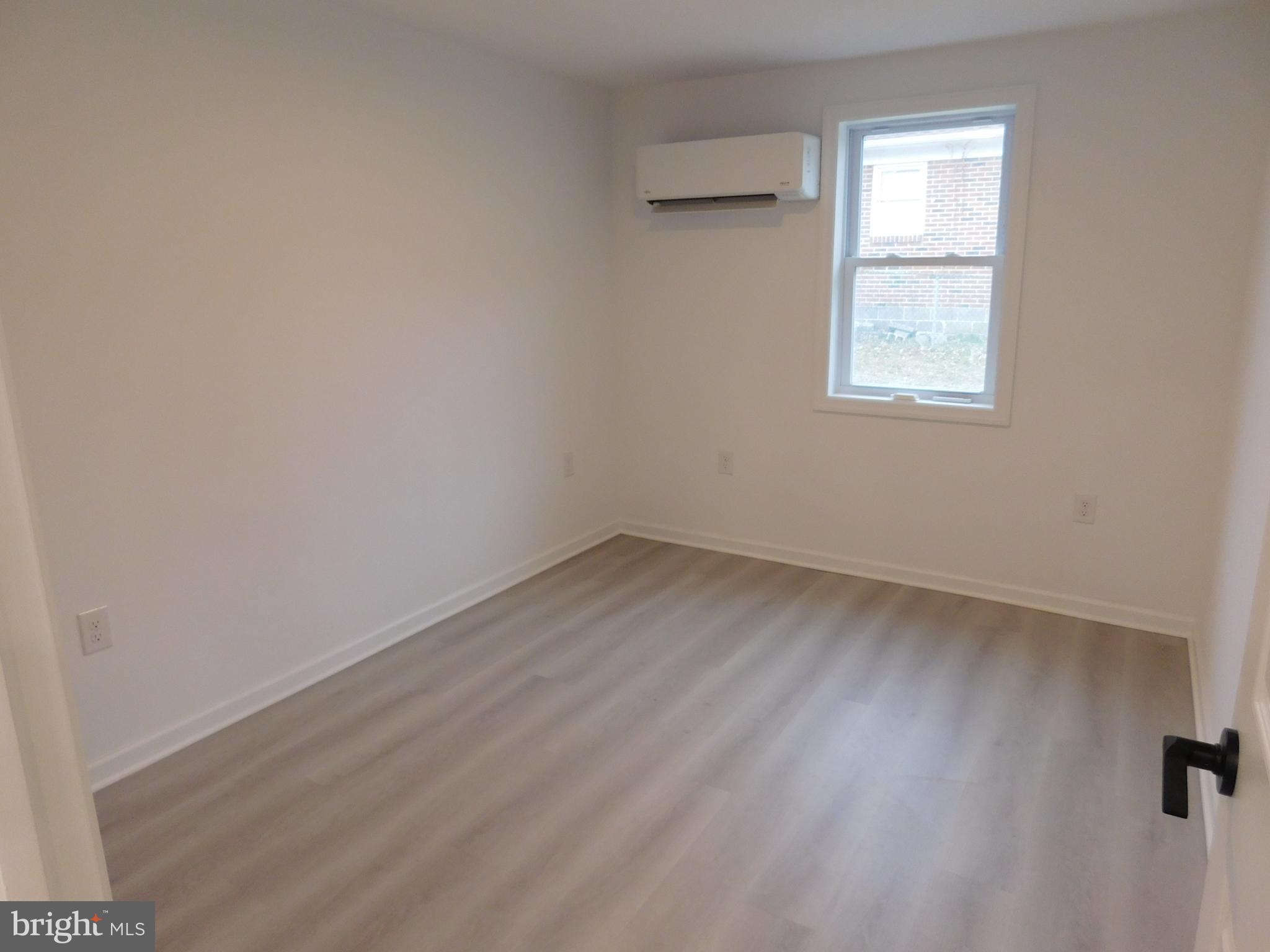 511 Cherry Street, Unit 4 Roebling, NJ 08554 - Photo 8 of 14 an empty room with a window