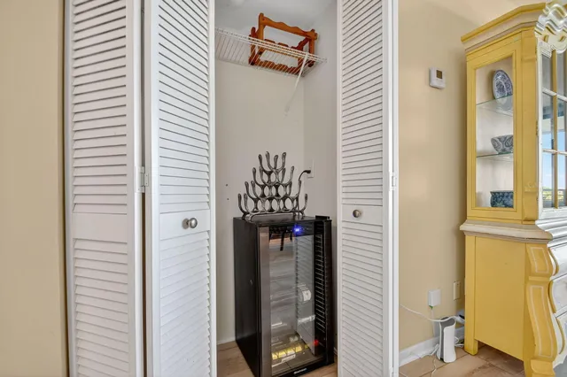 a view of a hallway with a door and wooden floor