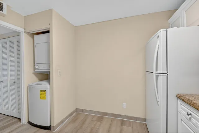 a view of storage and utility room with closet