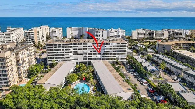 a view of a house with backyard porch and sitting area