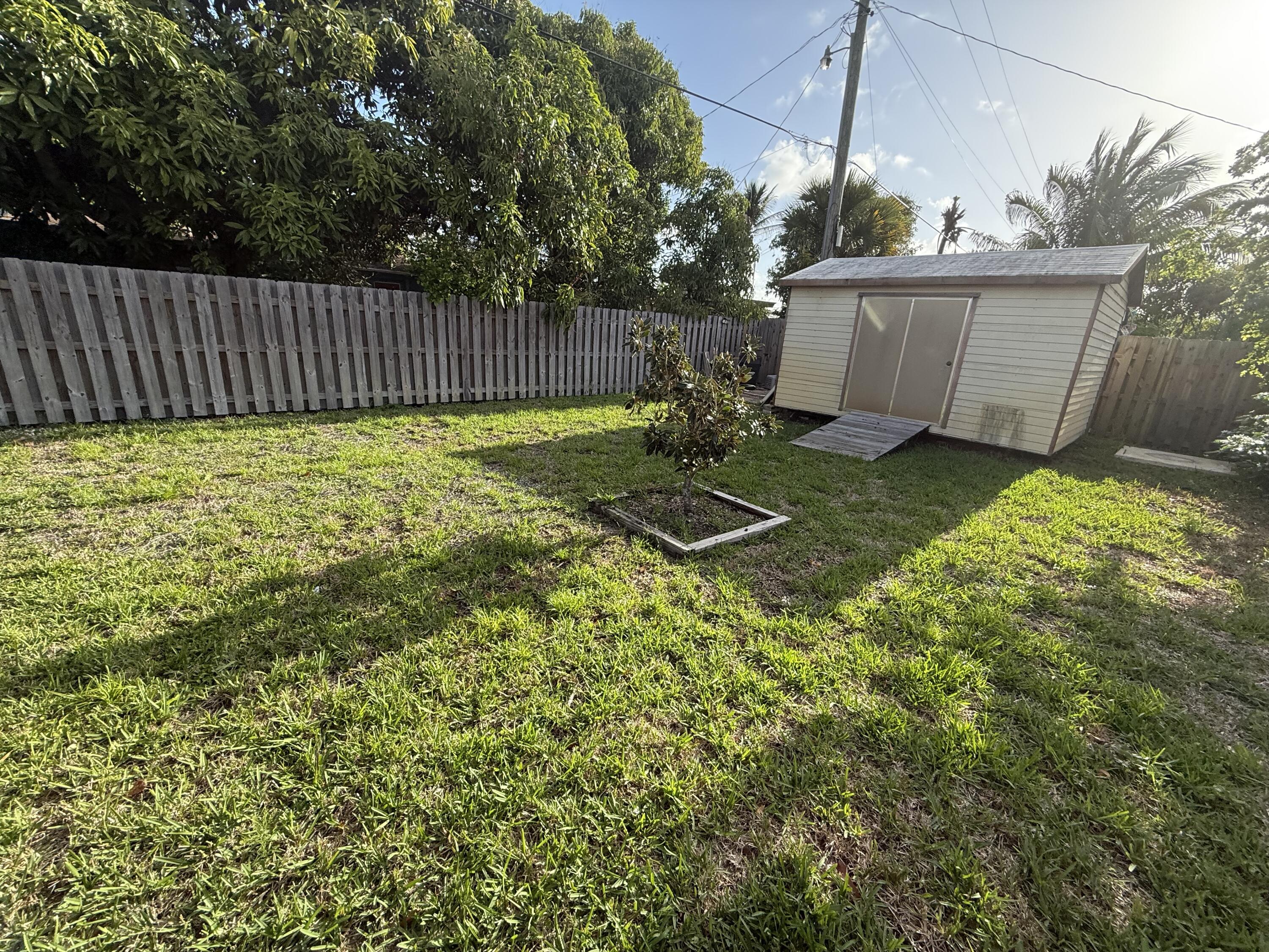 817 Elm Road West Palm Beach, FL 33409 - Photo 3 of 4 a view of a backyard with garden