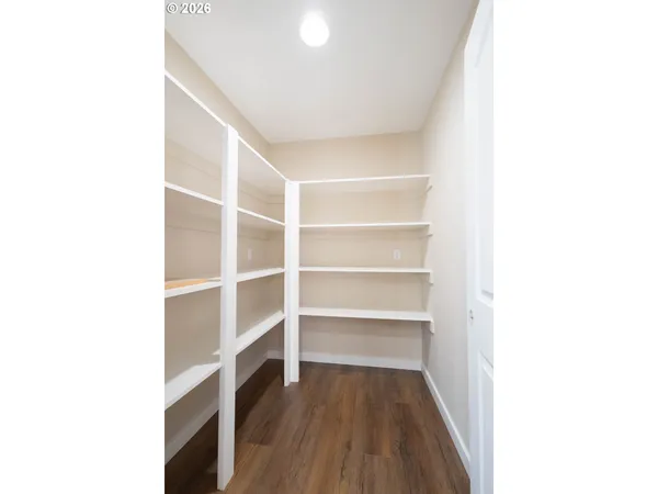 a view of a room with a wooden floor
