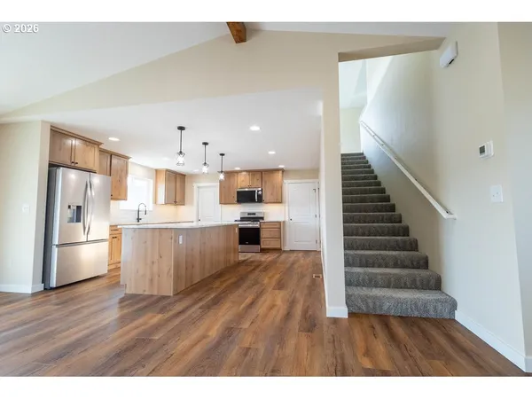 a view of kitchen with wooden floor