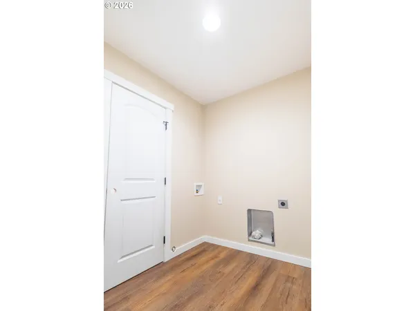 a view of a livingroom with wooden floor