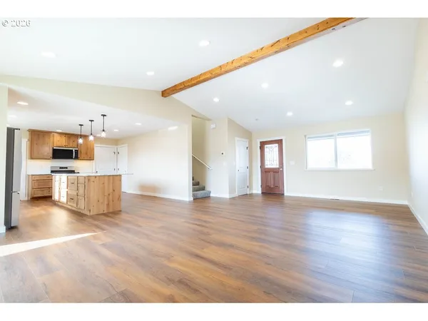 a view of a kitchen with a sink and a kitchen counter top space