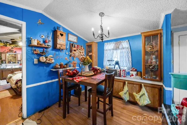 a view of a dining room with furniture and a window
