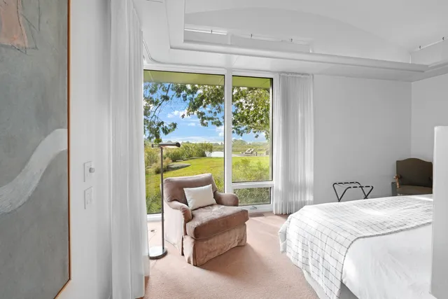 a view of balcony with wooden floor and outdoor seating