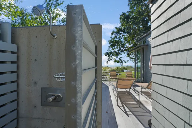 a view of a hallway with seating area