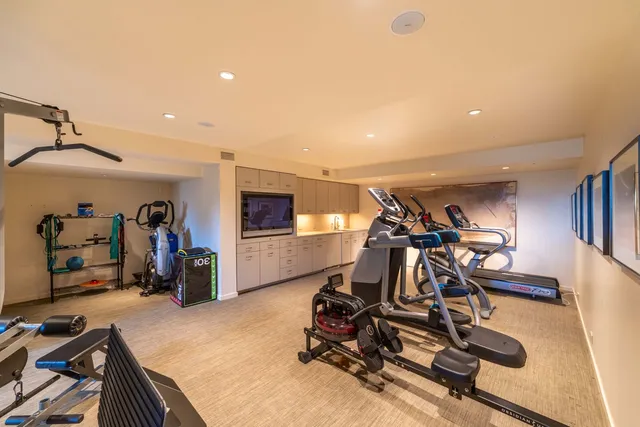 a spacious bathroom with a tub sink and mirror