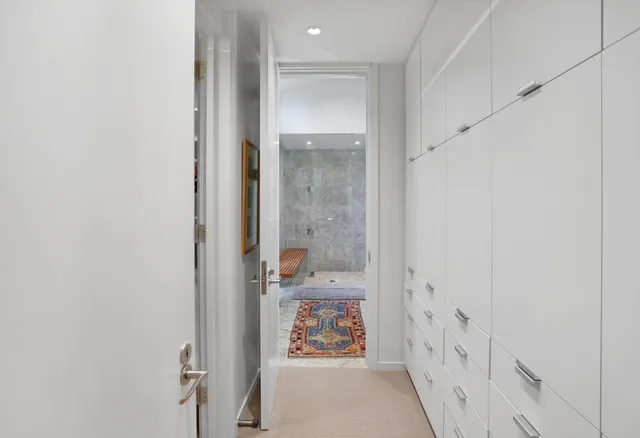 a bathroom with a granite countertop bathtub shower sink and mirror