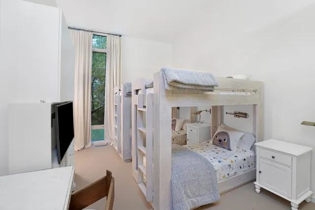 a view of a house with a yard and plants