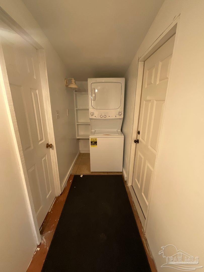 809 West Government Street Pensacola, FL 32502 - Photo 11 of 15 a view of a hallway with white walls and stairs