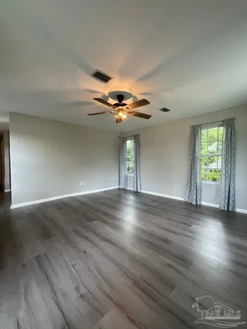 a view of livingroom with hardwood floor and ceiling fan