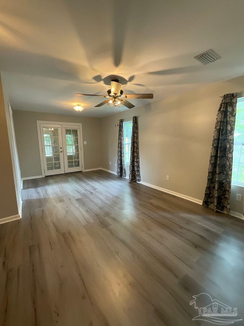 809 West Government Street Pensacola, FL 32502 - Photo 6 of 15 a view of an empty room with a window