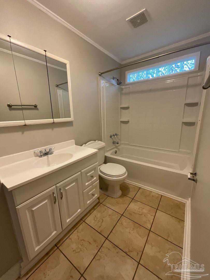 809 West Government Street Pensacola, FL 32502 - Photo 10 of 15 a bathroom with a sink a toilet and a mirror