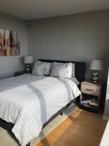 a bed room with a bed and a couch