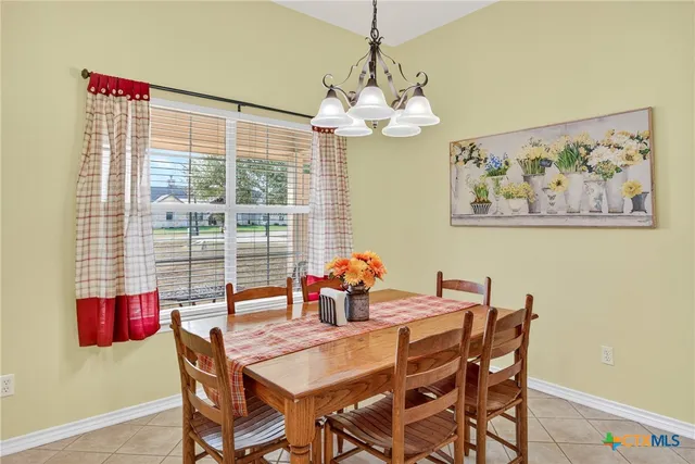 a view of a dining room and livingroom with furniture