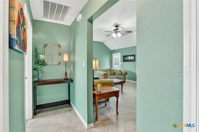 an empty room with a fireplace