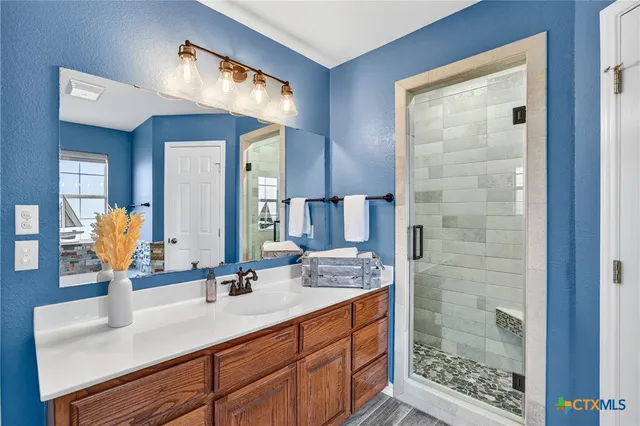 a bathroom with a bathtub and a window