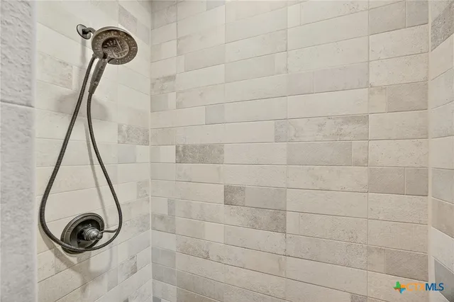 a view of a hallway view with wooden floor and staircase