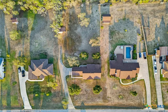 aerial view of a house with a yard