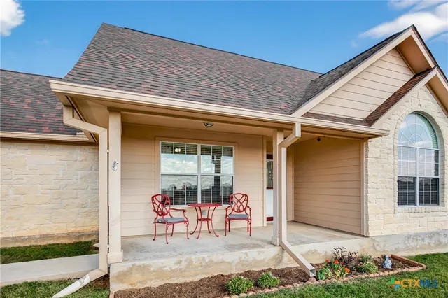 front view of a house with a outdoor seating