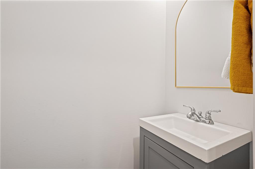 4808 Lima Way Pittsburgh, PA 15224 - Photo 11 of 26 a bathroom with a sink and a mirror