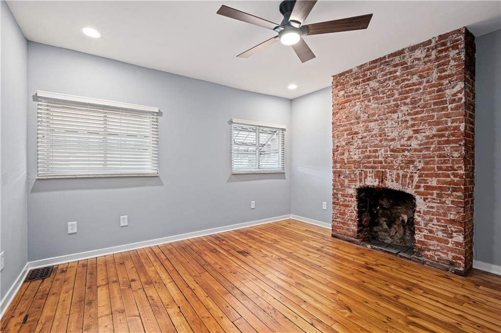 4808 Lima Way Pittsburgh, PA 15224 - Photo 13 of 26 a view of empty room with wooden floor and fireplace